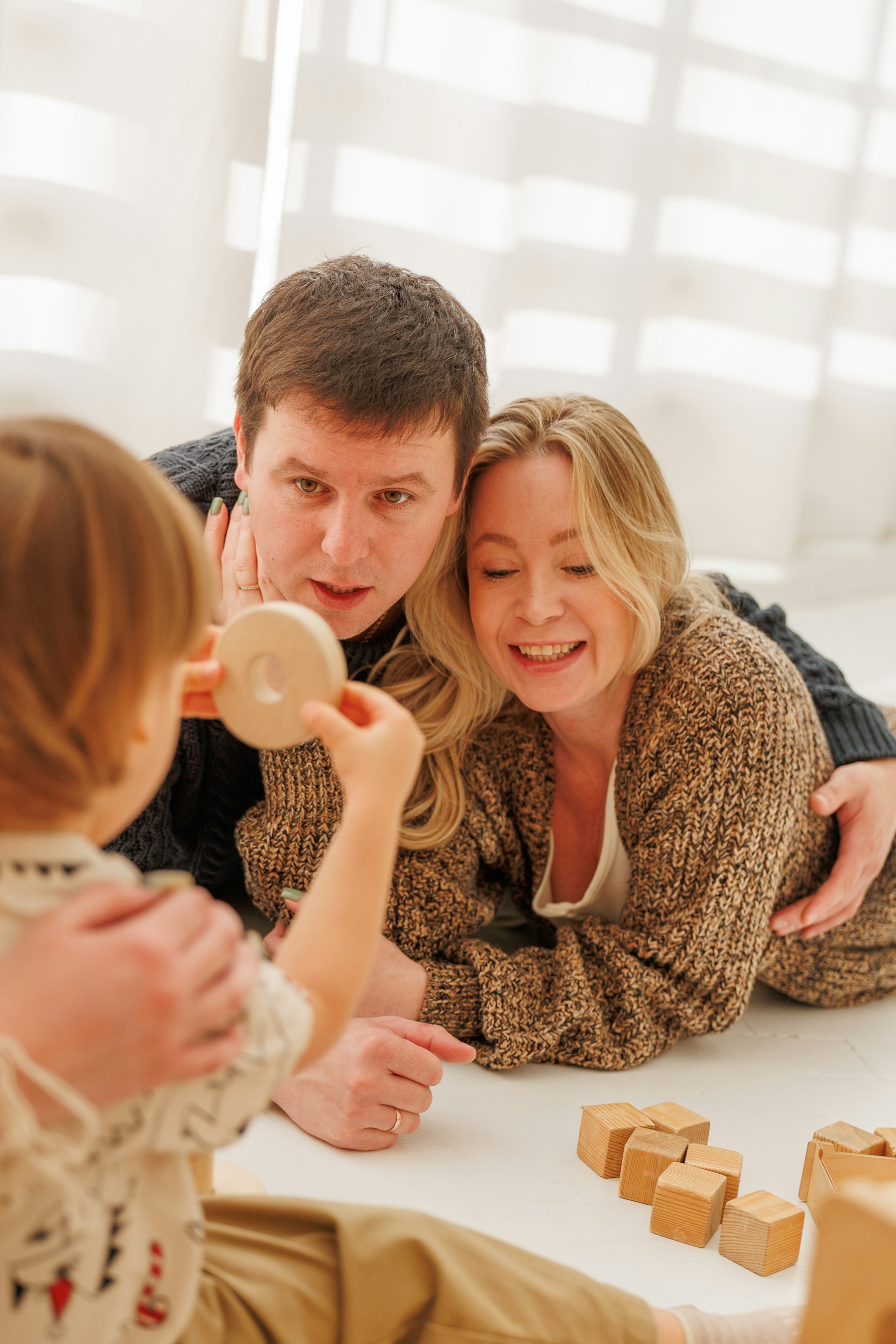 Family playing together with building blocks